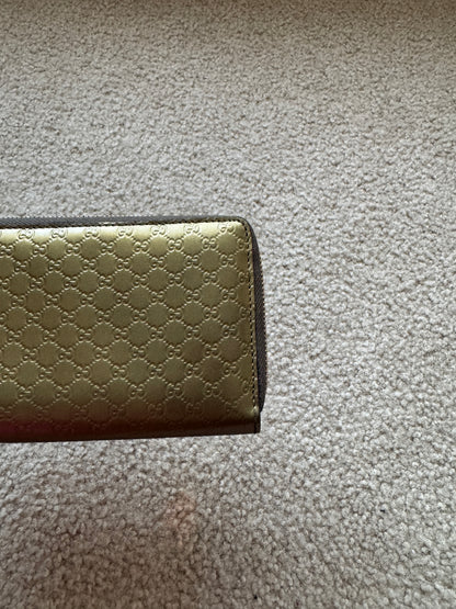 Gucci zippy heart wallet monogram gold